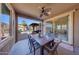 Outdoor dining area with sliding glass doors leading to the backyard at 17842 W Chuckwalla Canyon Rd, Goodyear, AZ 85338