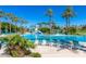 Resort-style pool with lounge chairs and palm trees at 17842 W Chuckwalla Canyon Rd, Goodyear, AZ 85338