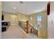 Upstairs hallway with a comfortable seating area and a view of the staircase at 17842 W Chuckwalla Canyon Rd, Goodyear, AZ 85338