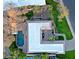 Aerial view of the house with pool, lush green lawn, and mature landscaping at 18 W Kaler Dr, Phoenix, AZ 85021