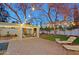 Beautiful backyard featuring a covered patio, a pool and spa, a firepit, and plenty of seating at 18 W Kaler Dr, Phoenix, AZ 85021