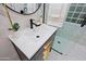 Stylish bathroom featuring a sleek vanity, contemporary faucet, and a modern glass enclosed shower at 18 W Kaler Dr, Phoenix, AZ 85021