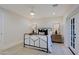 Bright bedroom featuring hardwood floors, ample natural light, and a modern wrought iron bed frame at 18 W Kaler Dr, Phoenix, AZ 85021