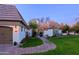 Charming single-story home featuring manicured lawn, paved driveway, and a two-car garage at 18 W Kaler Dr, Phoenix, AZ 85021