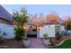 Attractive front gate with manicured landscaping enhances this home's curb appeal at 18 W Kaler Dr, Phoenix, AZ 85021