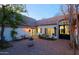 Inviting courtyard with manicured landscaping, an elegant fountain, and cozy outdoor seating at 18 W Kaler Dr, Phoenix, AZ 85021