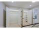 Hallway featuring closet doors and natural light at 18 W Kaler Dr, Phoenix, AZ 85021