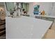 Kitchen island with white countertop at 18 W Kaler Dr, Phoenix, AZ 85021