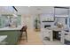 View of the kitchen with island and a view to the dining room at 18 W Kaler Dr, Phoenix, AZ 85021