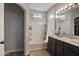 Bathroom with a double sink vanity, tub, and shower at 18250 N Cave Creek Rd # 180, Phoenix, AZ 85032