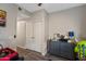 bedroom featuring laminate flooring, closet, chest of drawers, and fun decor at 18250 N Cave Creek Rd # 180, Phoenix, AZ 85032