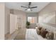 Cozy bedroom with neutral tones, a ceiling fan, and natural light from a window at 18250 N Cave Creek Rd # 180, Phoenix, AZ 85032