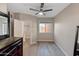 Simple bedroom with a window and a dresser at 18250 N Cave Creek Rd # 180, Phoenix, AZ 85032