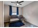 This bedroom is complete with dark blue curtains, a chair, and a day bed at 18250 N Cave Creek Rd # 180, Phoenix, AZ 85032