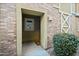 Apartment entrance featuring a covered doorway, exterior lighting, and address number at 18250 N Cave Creek Rd # 180, Phoenix, AZ 85032