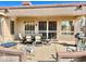 Spacious backyard patio with seating area and fire pit at 18328 N Avalon Ln, Surprise, AZ 85374