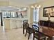 Bright dining room with a wooden table and chairs at 18328 N Avalon Ln, Surprise, AZ 85374