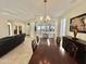 Bright dining room with a large wooden table and kitchen view at 18328 N Avalon Ln, Surprise, AZ 85374