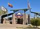 Entrance to Del E Webb Memorial Ballfield, with American and Arizona flags at 18328 N Avalon Ln, Surprise, AZ 85374