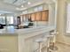 Kitchen features a breakfast bar with white quartz countertops at 18328 N Avalon Ln, Surprise, AZ 85374