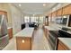 Bright kitchen with an island, stainless steel appliances, and ample counter space at 18328 N Avalon Ln, Surprise, AZ 85374