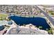 Aerial view of community lake and surrounding homes at 19601 N Krupps Ct, Maricopa, AZ 85138