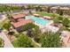 Community pool, clubhouse, and playground are seen from above at 19601 N Krupps Ct, Maricopa, AZ 85138