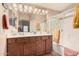 Bathroom with a double vanity and a shower/tub combo at 19601 N Krupps Ct, Maricopa, AZ 85138