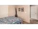 Bright bedroom with floral bedding and ensuite access at 19601 N Krupps Ct, Maricopa, AZ 85138