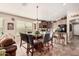 Bright dining area with glass-top table and leather chairs at 19601 N Krupps Ct, Maricopa, AZ 85138