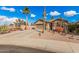 Single-story home with desert landscaping and two-car garage at 19601 N Krupps Ct, Maricopa, AZ 85138