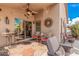 Covered patio with comfortable seating and ceiling fan at 19601 N Krupps Ct, Maricopa, AZ 85138