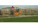 playground with play structures and shaded seating at 19601 N Krupps Ct, Maricopa, AZ 85138