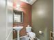 Small bathroom with pedestal sink, toilet, and neutral earth tone colored walls at 2022 W Briana Way, San Tan Valley, AZ 85144