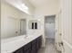 Bathroom featuring a double sink vanity with a large mirror and tile floors at 2022 W Briana Way, Queen Creek, AZ 85144