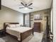 Bedroom with ceiling fan, shelves, and carpet at 2022 W Briana Way, San Tan Valley, AZ 85144