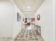 Hallway view of a living room area with tile floors and white walls at 2022 W Briana Way, Queen Creek, AZ 85144