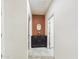 Hallway view with dark wood cabinet and tan colored accent wall at 2022 W Briana Way, San Tan Valley, AZ 85144