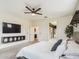 Open main bedroom layout with neutral walls, ceiling fan, and en-suite bathroom at 2022 W Briana Way, San Tan Valley, AZ 85144