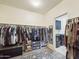 Well-organized walk-in closet with ample storage and access to laundry room at 2022 W Briana Way, Queen Creek, AZ 85144