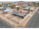 Aerial view of house with solar panels and fenced yard at 203 E Beech Ave, Casa Grande, AZ 85122