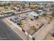 Aerial view of house with solar panels and fenced yard at 203 E Beech Ave, Casa Grande, AZ 85122