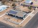 Aerial view of a house with solar panels and a large backyard at 203 E Beech Ave, Casa Grande, AZ 85122