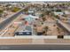 Aerial view of house with solar panels and fenced yard at 203 E Beech Ave, Casa Grande, AZ 85122