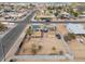 Aerial view of house with solar panels and fenced yard at 203 E Beech Ave, Casa Grande, AZ 85122