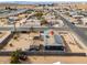 Aerial view of a house with solar panels and a large backyard at 203 E Beech Ave, Casa Grande, AZ 85122