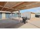 Backyard with covered patio, shed, and grill at 203 E Beech Ave, Casa Grande, AZ 85122