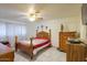 Bedroom with wood furniture and tile floors at 203 E Beech Ave, Casa Grande, AZ 85122