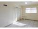 Simple bedroom with tile flooring and closet at 203 E Beech Ave, Casa Grande, AZ 85122