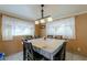 Bright dining room with table and chairs, ready for Gathering meals at 203 E Beech Ave, Casa Grande, AZ 85122